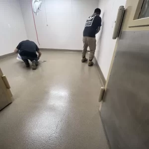 High performance industrial epoxy flooring installed by expert commercial contractors in a large manufacturing facility