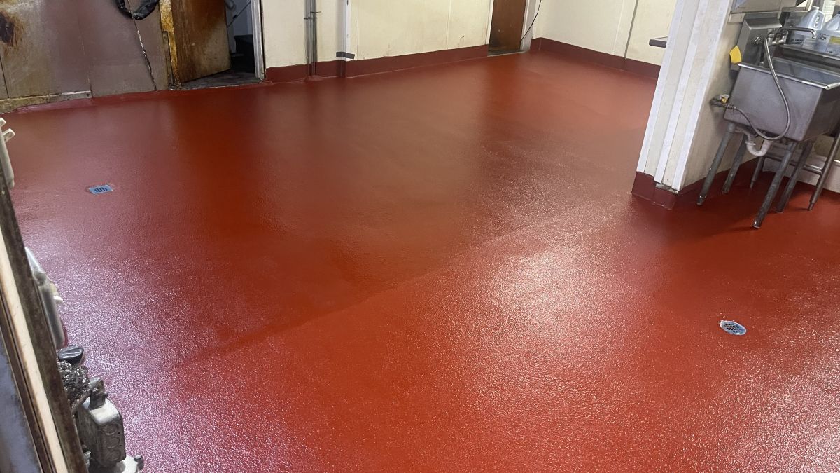 Seamless red antimicrobial urethane cement flooring for a commercial kitchen in Red Bank, NJ