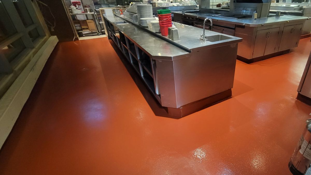 Commercial kitchen flooring in Montclair NJ featuring a slip-resistant urethane slurry system for high-traffic food preparation areas.